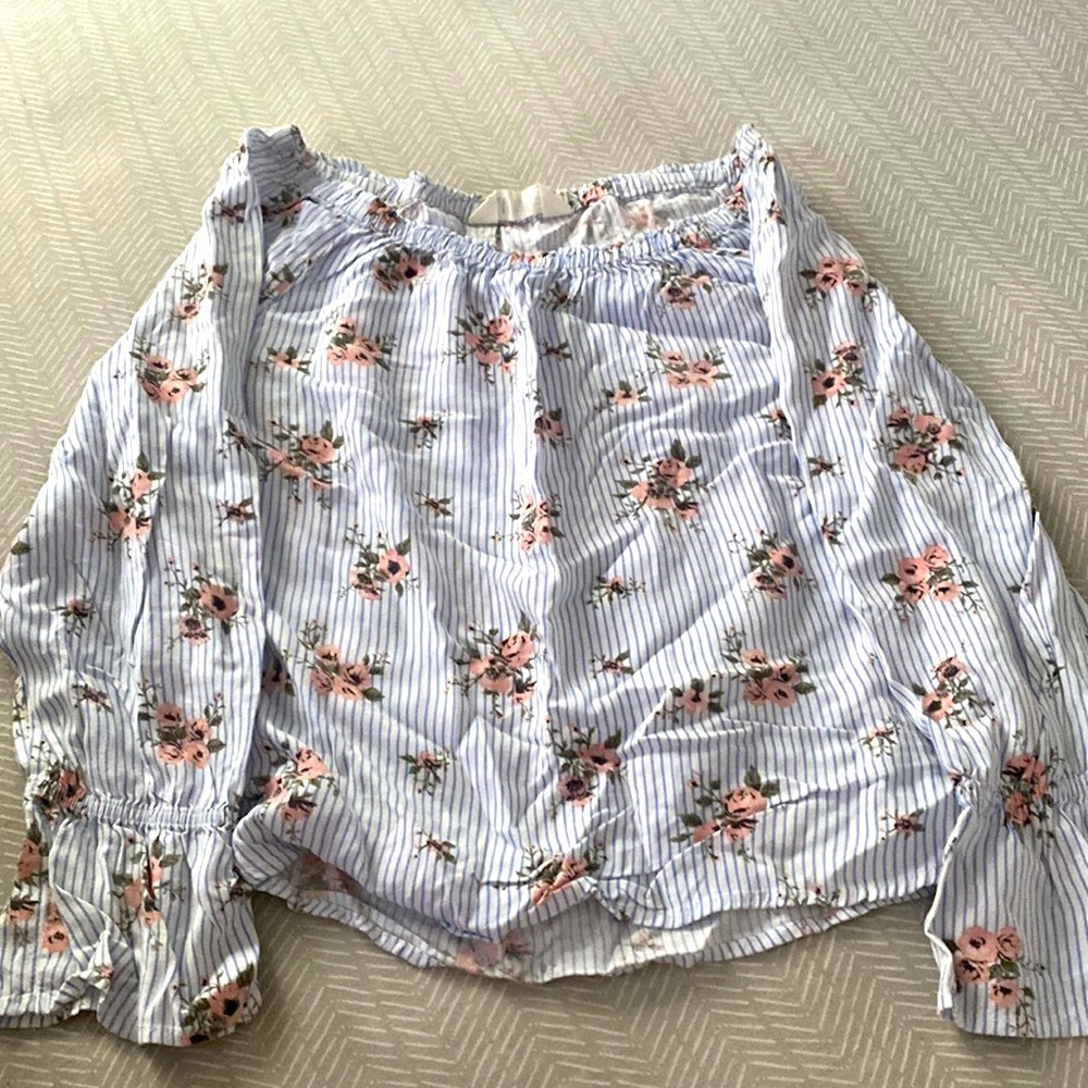 Off the shoulder long sleeve shirt.